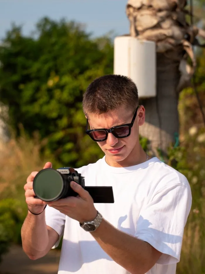 House of Advanced co-founder Panagiotis Chatzis holding a camera