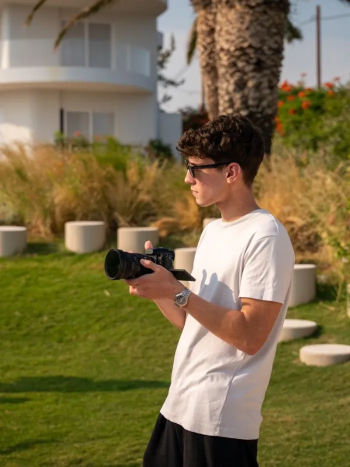 House of Advanced co-founder Apostolos Lemonis holding a camera