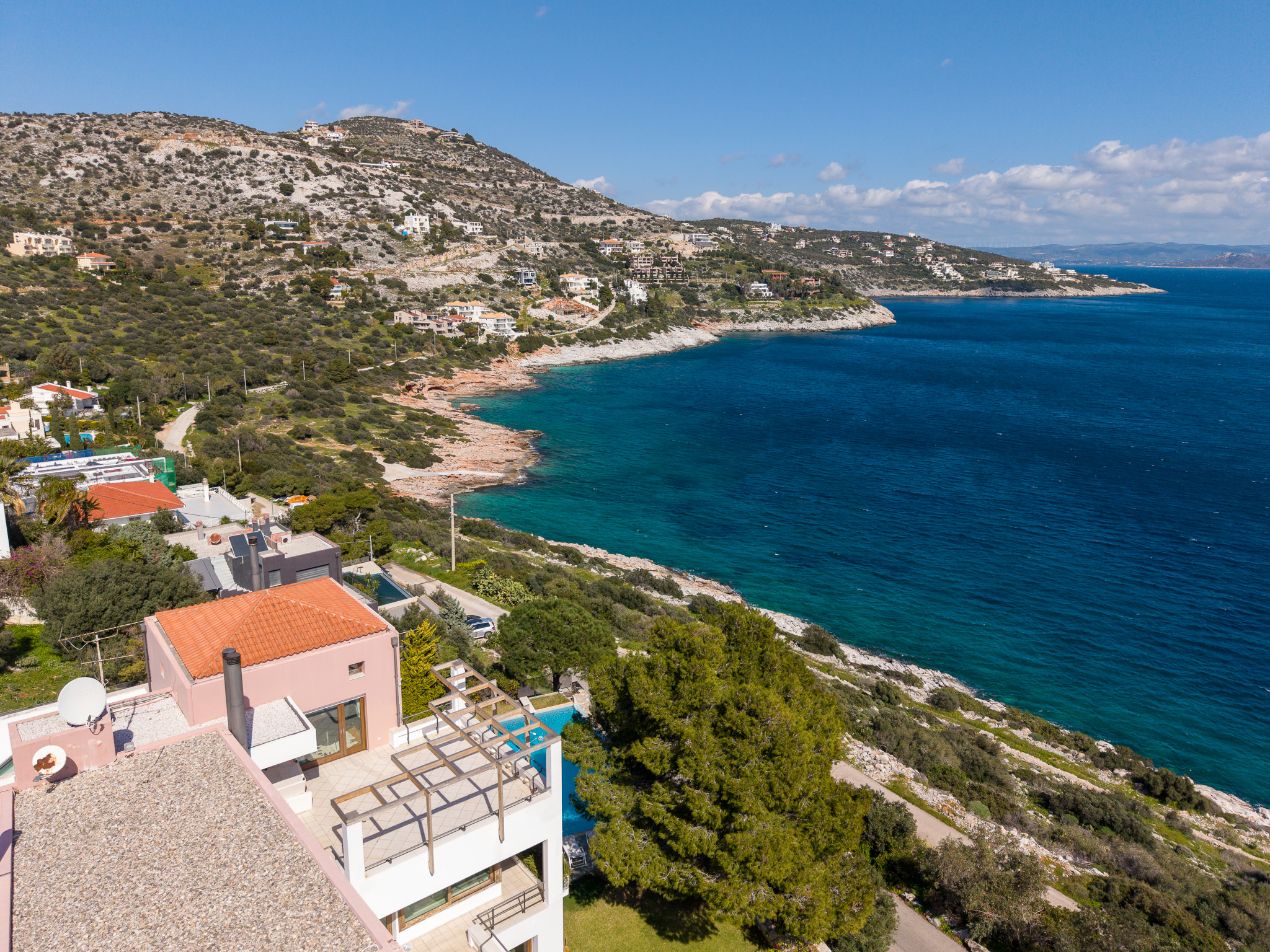 Villa Selene, daytime hilltop view of villa, coastline and bay